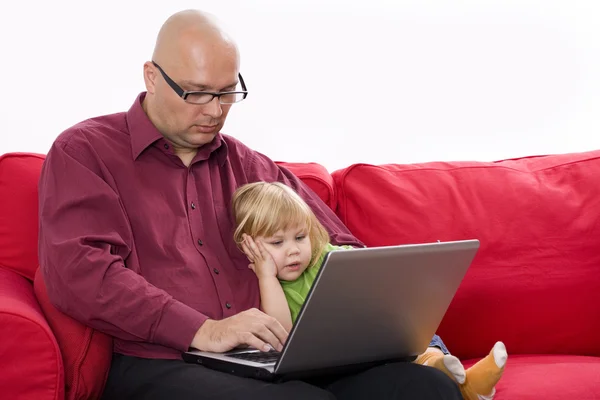 Little girl with father on the computer