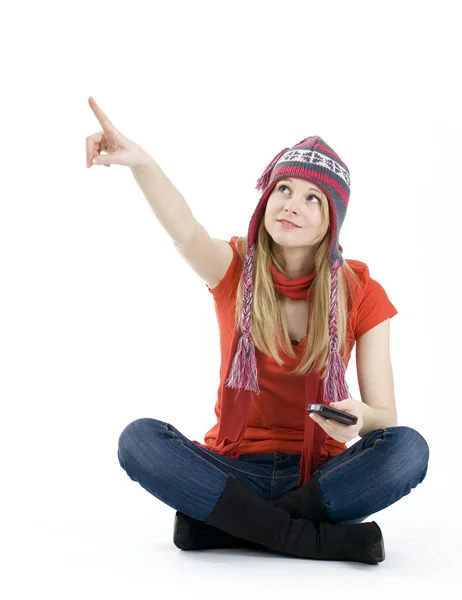Girl in winter cap pointing