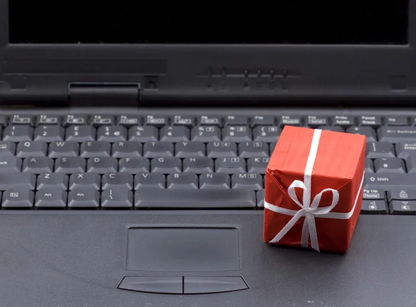 Small gift box on laptop keyboard