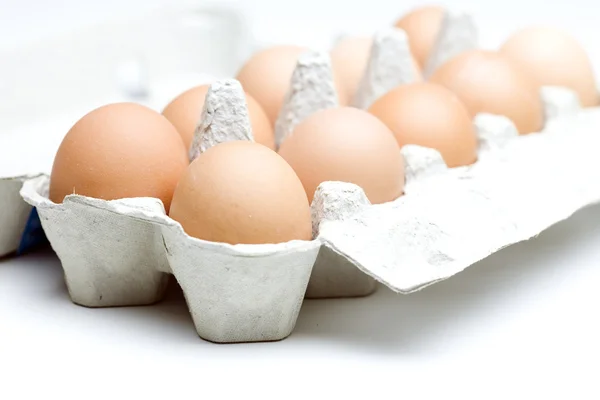 Open carton egg box with eggs