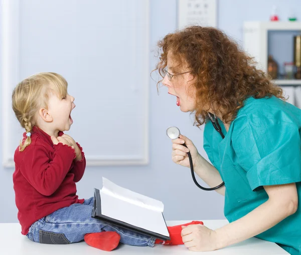 Doctor pediatrician exam baby mouth