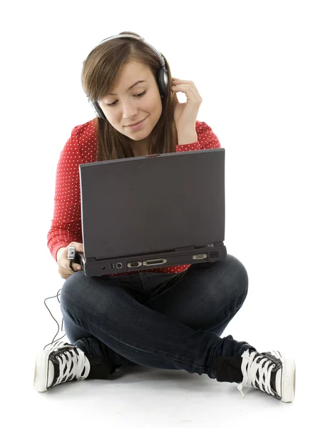 Young girl with laptop and mp3