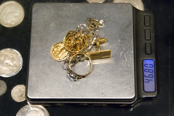 Gold jewelry and scale