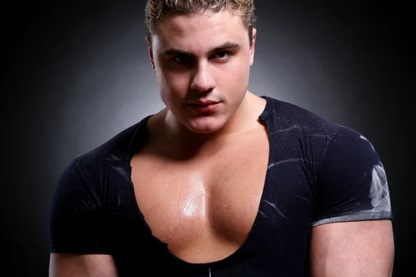 Young and beautiful muscle man by Sergejs Rahunoks Stock Photo