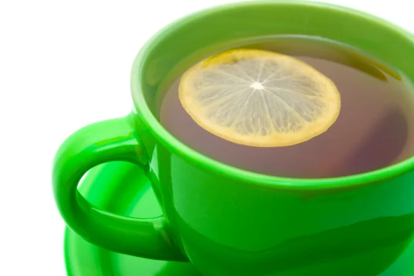 Lemon tea in green cup.