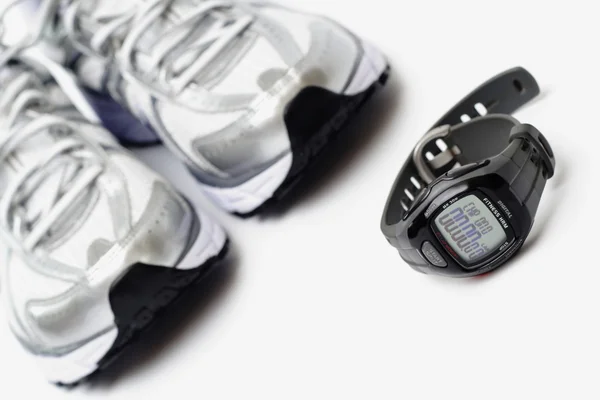 Sport watch and pair of trainers