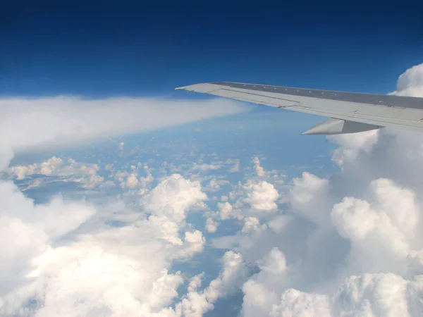 airplane wing above clouds — Stock Photo #1623864
