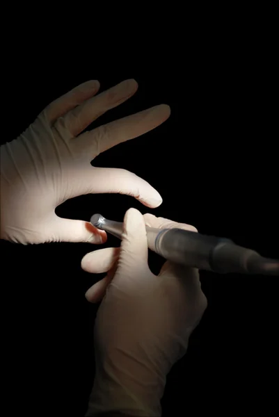 Dentist`s hands, treatment imitating