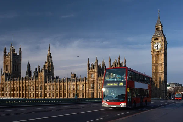 Big Ben tower and red bus