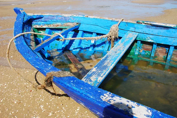Old hull fishing blue boat