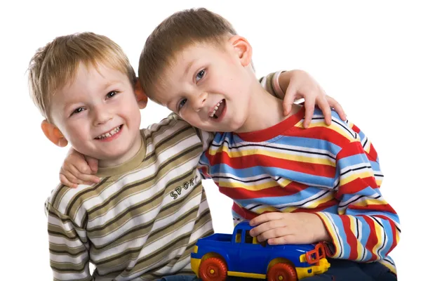 Two young boys cheerfully play by Larisa Lofitskaya Stock Photo