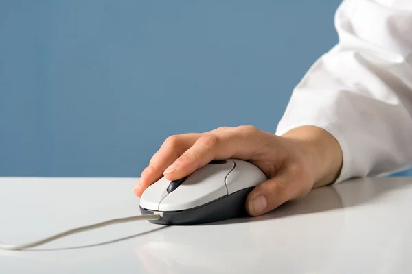 Hand holds the computer mouse