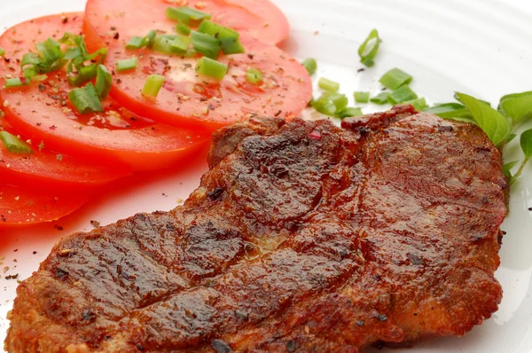 Grilled steak with vegetable salad