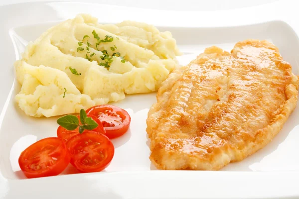 Fried fish fillet with boiled potatoes