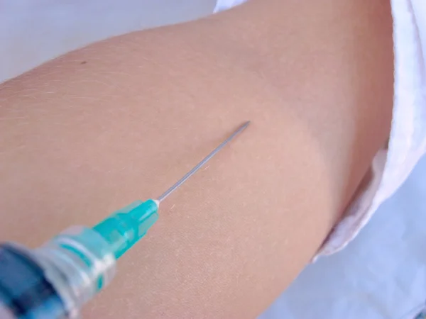 Injection of a drug in a vein