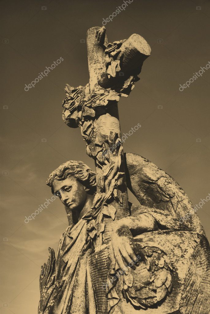 Old style photo of angel statue in cemetery