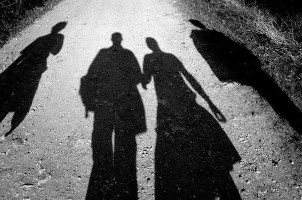 Four people walking together by Vladislav Mitic Stock Photo
