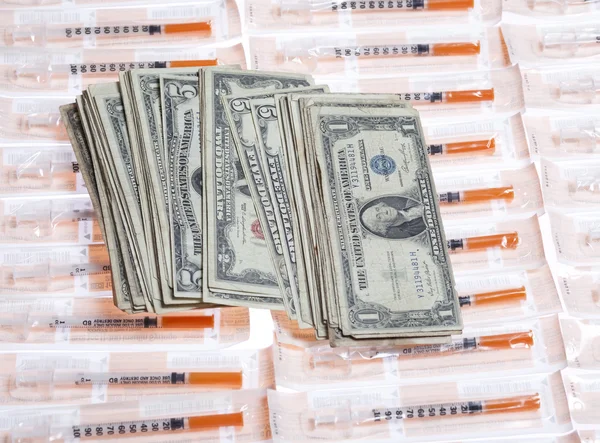 US money with syringes