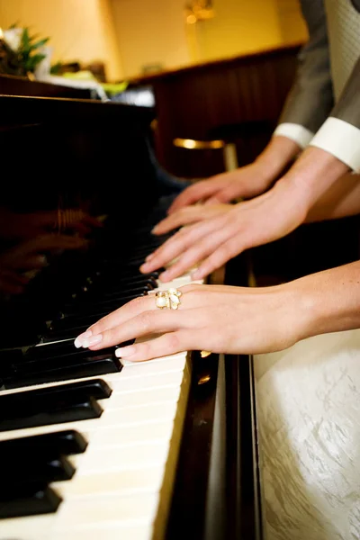 Couple playing piano