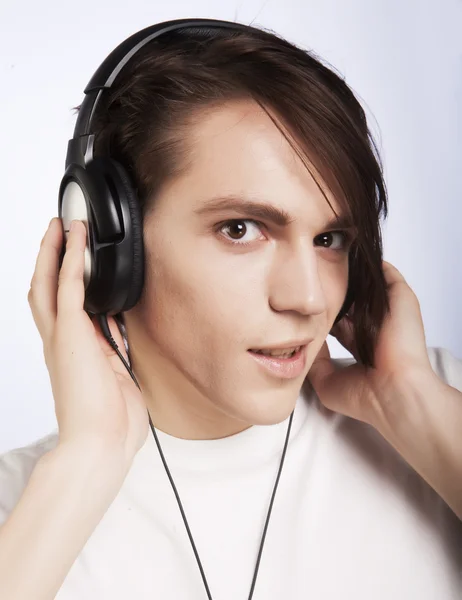 Casual man listening to music