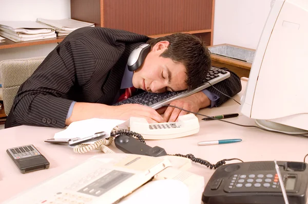 Businessman sleeping at office