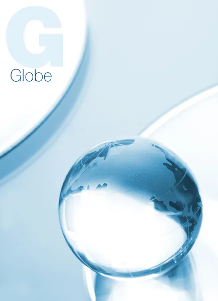 Globe made of glass in blue ambient ligh