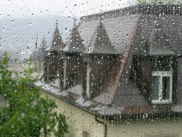 Through raindrops on the window