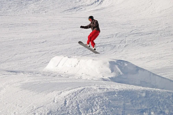 Snowboarder on the ski jump