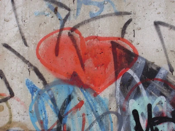 Red graffiti heart on the walls.