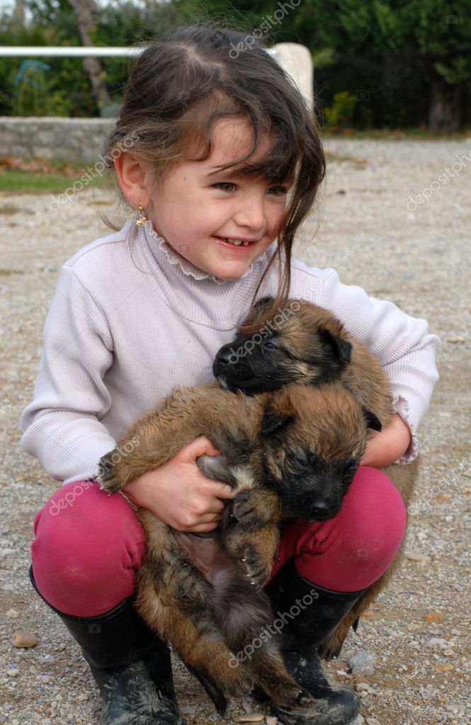 Girl And Puppies