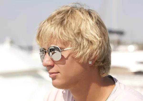 Blond man in sun glasses