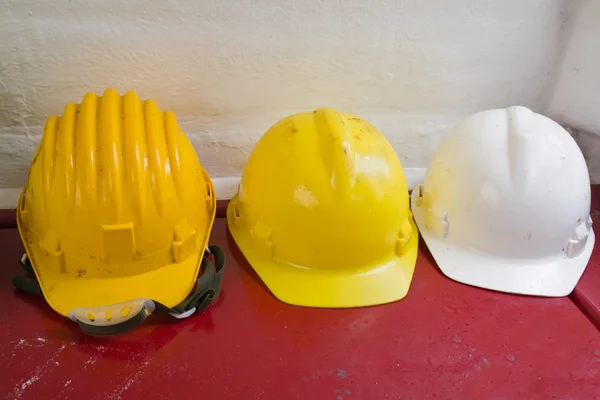Yellow and white hard hats