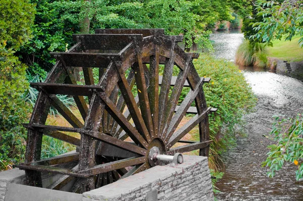 Old wooden Water wheel and stream
