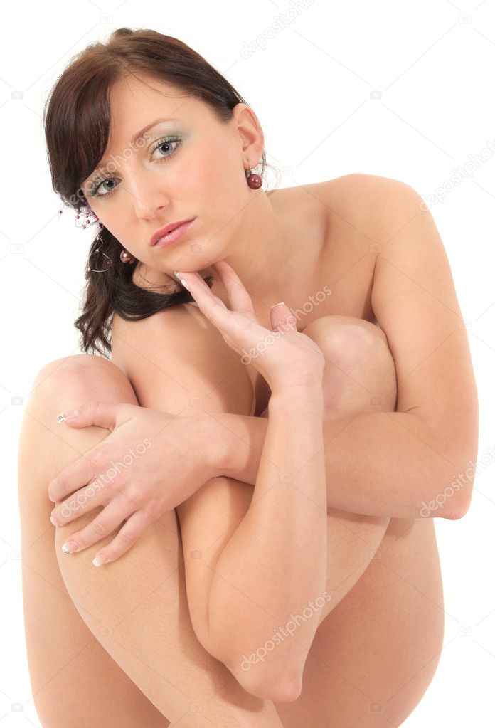 Portrait of young naked girl in pose studio shot