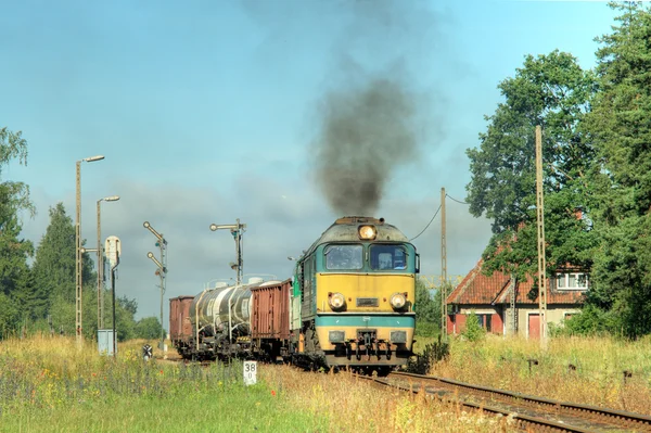 Freight train starting from the station