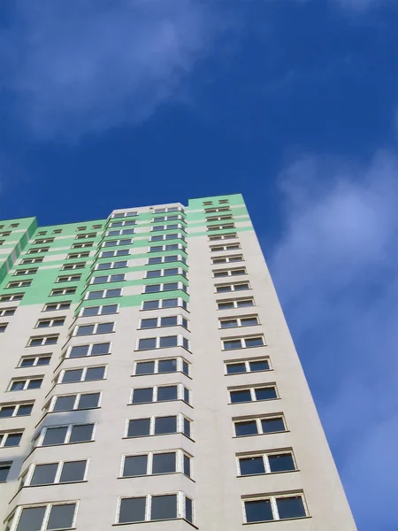 New colorful green building, blue sky