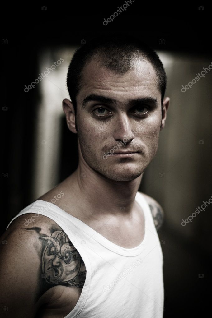 Portrait of young tattooed man