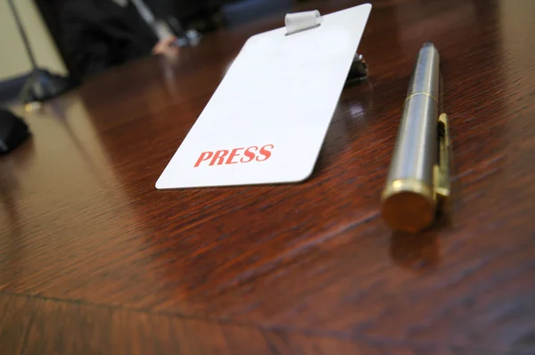 Press identification card on the table
