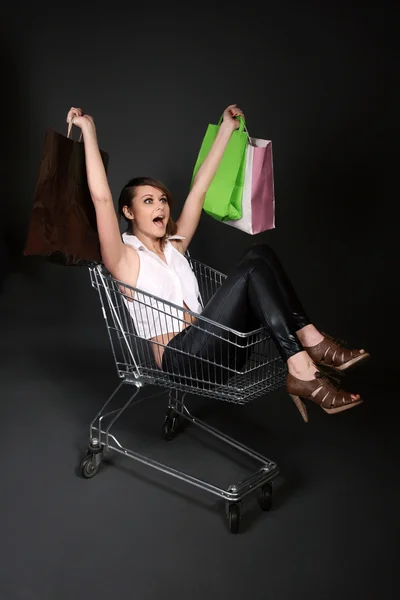 Happy woman in the shopping cart