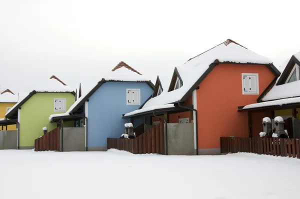 Colored houses in snow