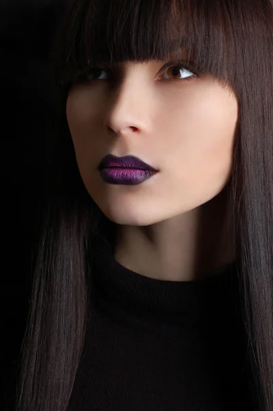 Beautiful woman with violet make-up