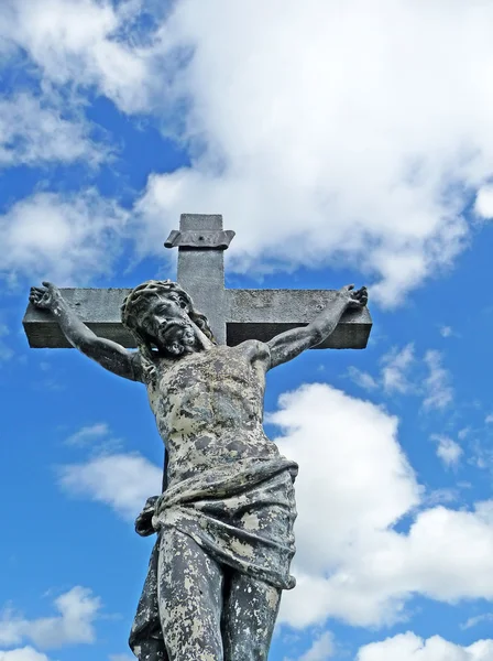 Weathered graveyard crucifixion statue