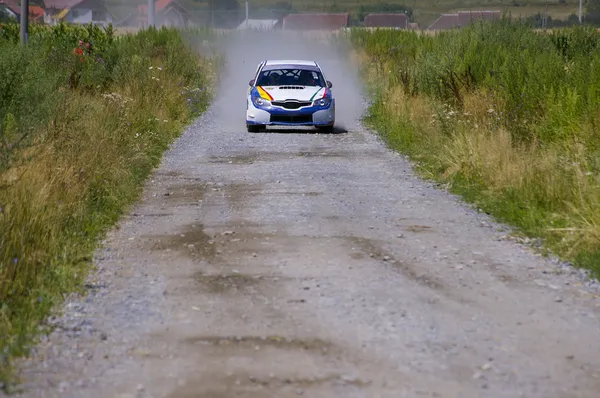 Rally car on gravel road