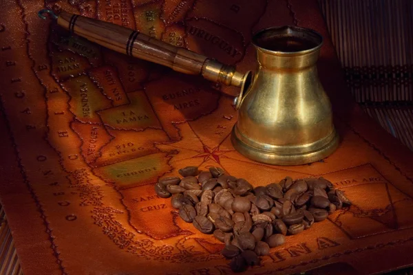 Coffee in a turk, grains and map