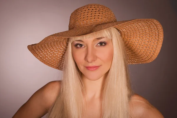 The beautiful blonde in a straw hat
