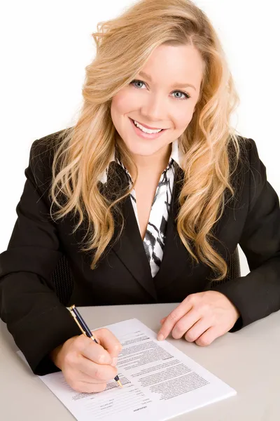 Young Businesswoman Signing a Document