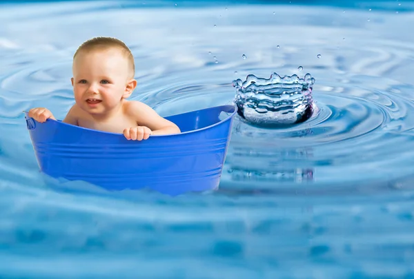 Baby floating in enlarged water photo