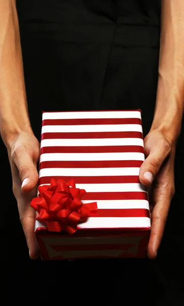 Business woman giving a gift