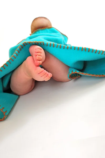 Child under blanket