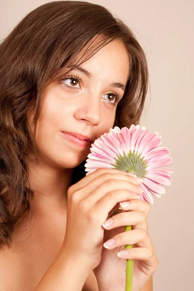 Young woman with pink flower by Xalanx Stock Photo young pink